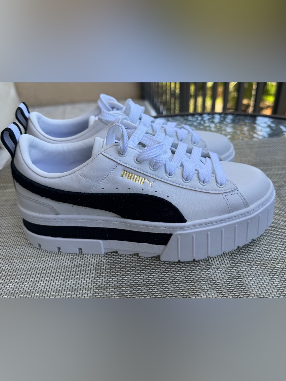 Puma women’s White Sneakers with Black Stripe and Gold Logo